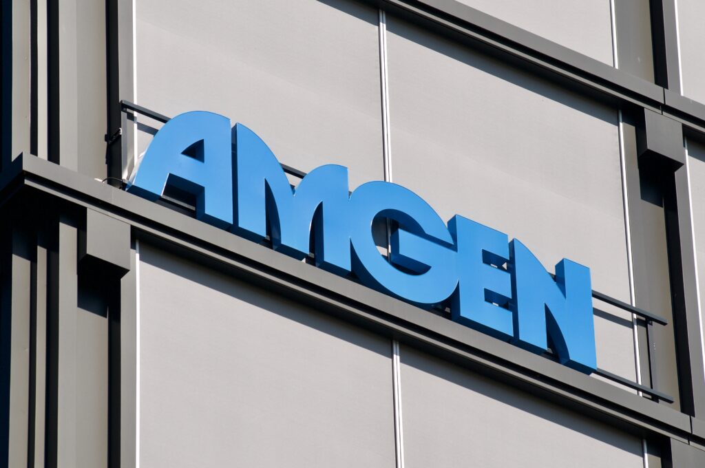 Amgen logo sign hanging on the office building in Rotkreuz, Switzerland. Amgen is an American multinational biopharmaceutical company