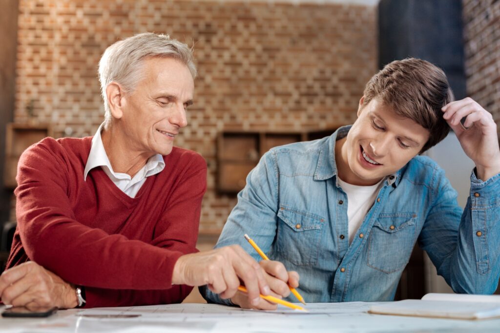 Retired mentor with young man